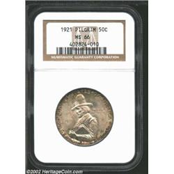 1921 50C Pilgrim MS66 NGC. A band of golden-brown and apple-green patina at the margins frames the p