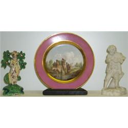 Early C19th Sevres hard-paste porcelain plate, the centre painted with a scene...