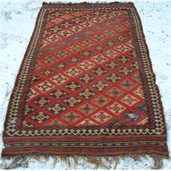 Early C20th Qashgai kelim with diagonal rows of coloured diamonds on brick-red...