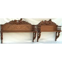 Carved walnut wallshelf, the crest modelled as a recumbent female figure, with...