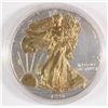 Image 1 : 1996 AMERICAN SILVER EAGLE ENHANCED WITH GOLD GILT ON THE OBVERSE, IN CAPSULE