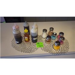 7 SQUEEZE BOTTLES OF FLAVORING AND 5 SHAKERS WITH TOPPINGS