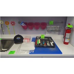 TRAY OF ASSORTED KNIVES, LADELS, CAN OPENERS, CUTTING BOARD, METAL RACK WITH BASKETS