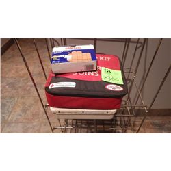 TWO FIRST AID KITS AND PARTIAL BOX OF BAND AIDS