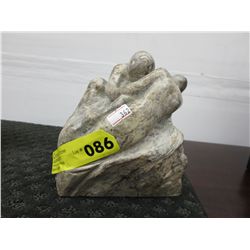Signed hand carved stone statue