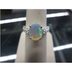 Large oval cut 1.12 CT opal solitaire ring