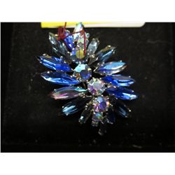 Unsigned blue rhinestone brooch.
