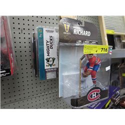 4 Hockey figurines in sealed pkgs.