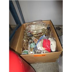 Box of Christmas decorations & ribbon.