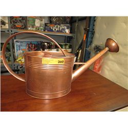 Copper coloured watering can