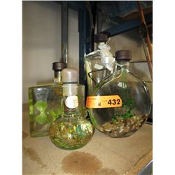 4 Glass containers containing oils