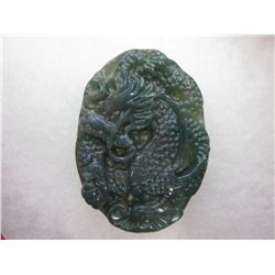 Hand carved green jade dragon pendant