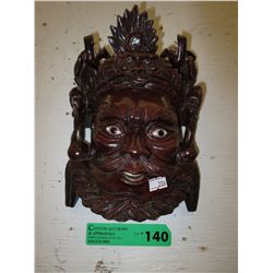 Carved oriental wall mask