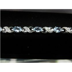 Blue topaz & diamond tennis bracelet