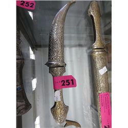 Metal knife in metal sheath