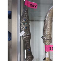Metal knife in metal sheath
