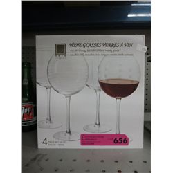 Four mouth-blown wine glasses