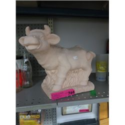Unglazed cow statue