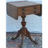 Image 1 : Early C19th George IV oak & ebony strung work table with drop-leaves flanking 2...