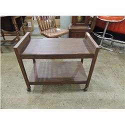 VINTAGE MOVEABLE TV STAND ON WHEELS