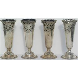 Set of four Edwardian HM silver pedestal vases with pierced floral decorations,...