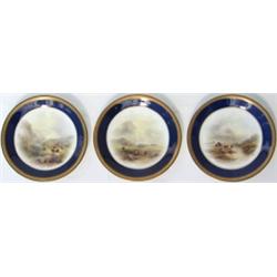 Set of three early C20th Royal Worcester porcelain plates with dark blue & gilt...