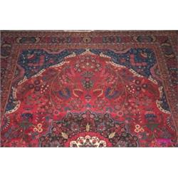 Mid C20th Meshed carpet with flowering shrubs & vases of flowers, on blue...