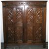 Image 1 : Early C20th carved oak 2-door cupboard with vine frieze & linenfold ends,...