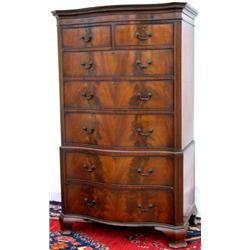 Early C20th mahogany serpentine fronted chest-on-chest with oak drawer linings...