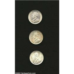 George V Dimes as follows: 1921, KM23a, AU; 1928, KM23a, lightly toned Uncirculated with a few hairl