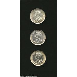 George V Dimes including: 1911, KM17, Choice AU; 1912, KM23, Choice AU; and a 1913 Small Leaves, KM2