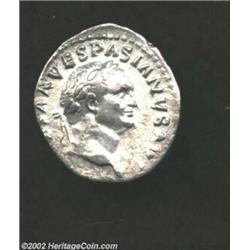 Vespasian, 69-79 AD, AR denarius, (3.3 gm.) Laureate head right/Judaea seated right at foot of troph