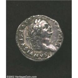 Vespasian, 69-79 AD, AR denarius, (3.0 gm.) Struck by Titus, Laureate head right/Victory standing le