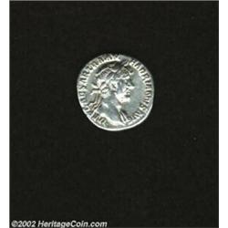 Hadrian, 117-138 A.D., AR denarius (3.56 g). Laureate bust right with drapery over left shoulder/ Em