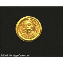 Theodosius II, 408-450 A.D., AV solidus (4.49 gm.), Constantinople mint, 425-429 A.D., Helmeted, cui