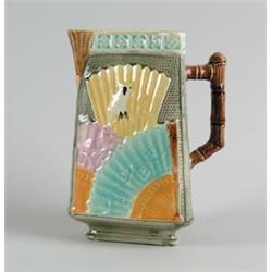 MAJOLICA: PITCHER IN THE TRIANGULAR, FAN, AND OWL MOTIF BY EUREKA…