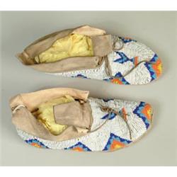 FINE PAIR OF SOUTHERN CHEYENNE FULLY BEADED MOCCASINS…