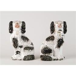 PAIR OF BLACK AND WHITE STAFFORDSHIRE DOGS…