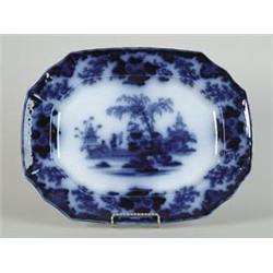 FLOW BLUE PLATTER IN THE SCINDE PATTERN…