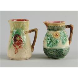 MAJOLICA: TWO FLOWER DECORATED CREAMERS…