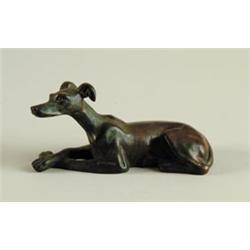 BRONZE FIGURE OF A RECLINING WHIPPIT…