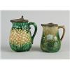 MAJOLICA: TWO METAL LID PITCHERS…