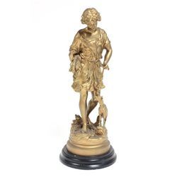 White metal statue of shepherd with goat