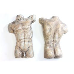 Pair of plaster torsos after the antique