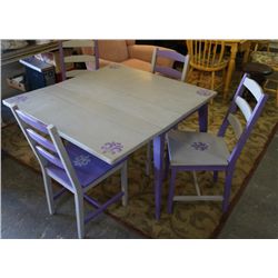Drop leaf table and four chairs.