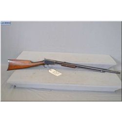 Winchester Mod 1890 .22 LR cal tube fed pump action Rifle w/24" oct bbl [ blue finish fading in carr