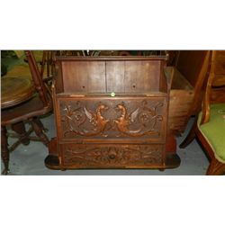 unique antique oak wall cabinet with winged animals,