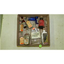 box of Primitive items including, advertising bottles