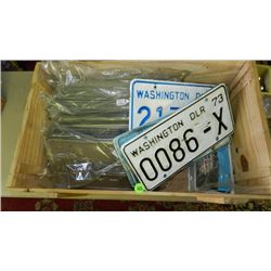 large box of vintage auto license plates