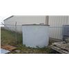 Image 1 : Fiberglass tank in corner of yard